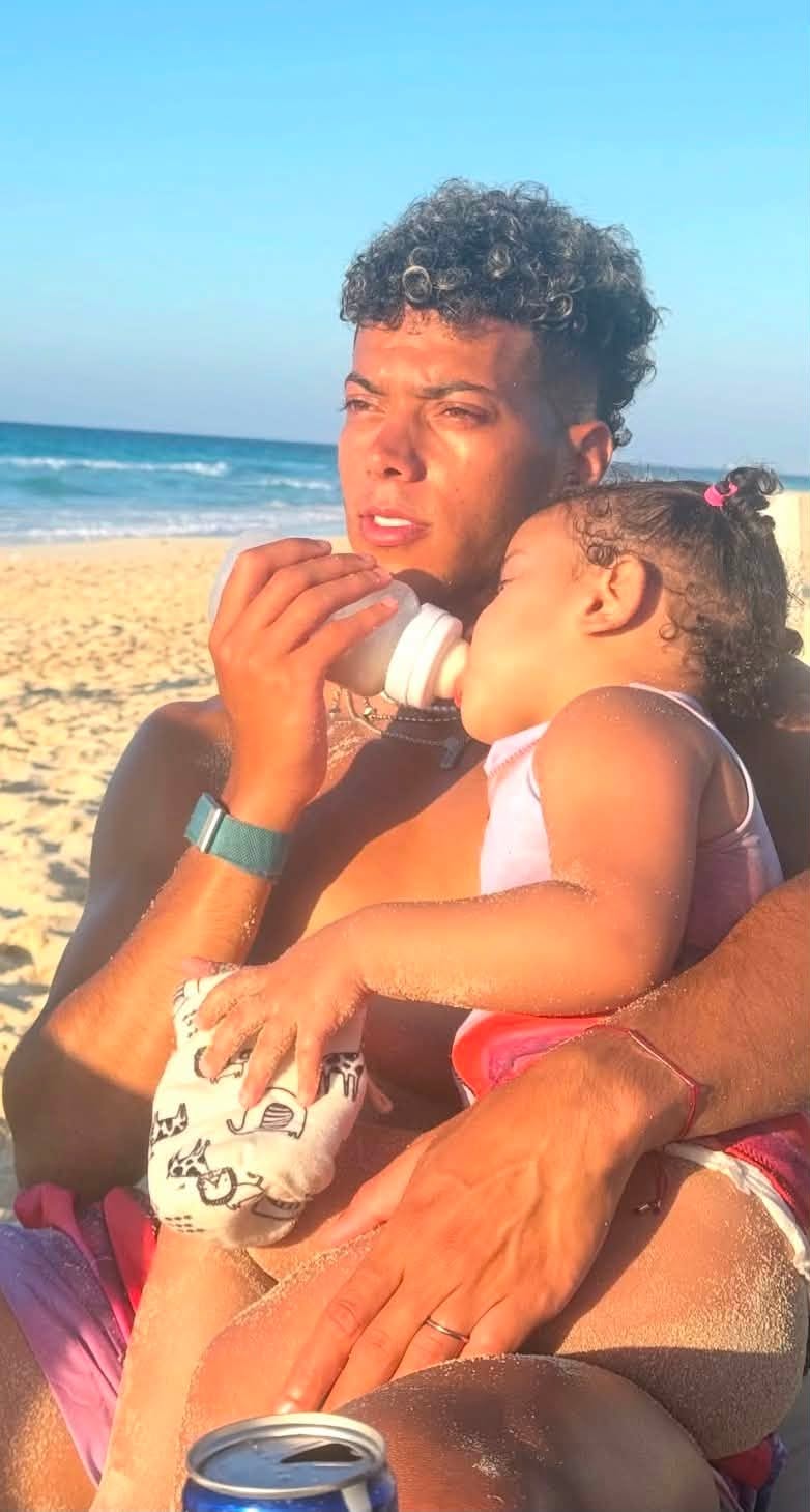 May be an image of baby, ocean and beach