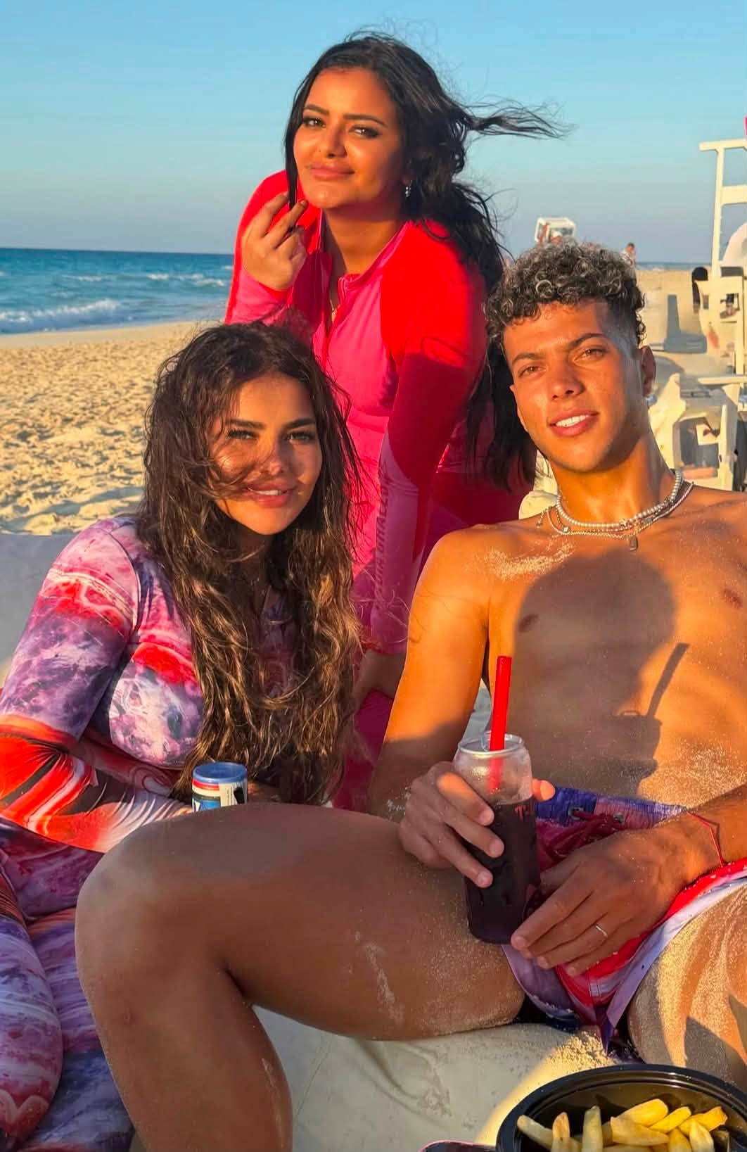 May be an image of one or more people and beach