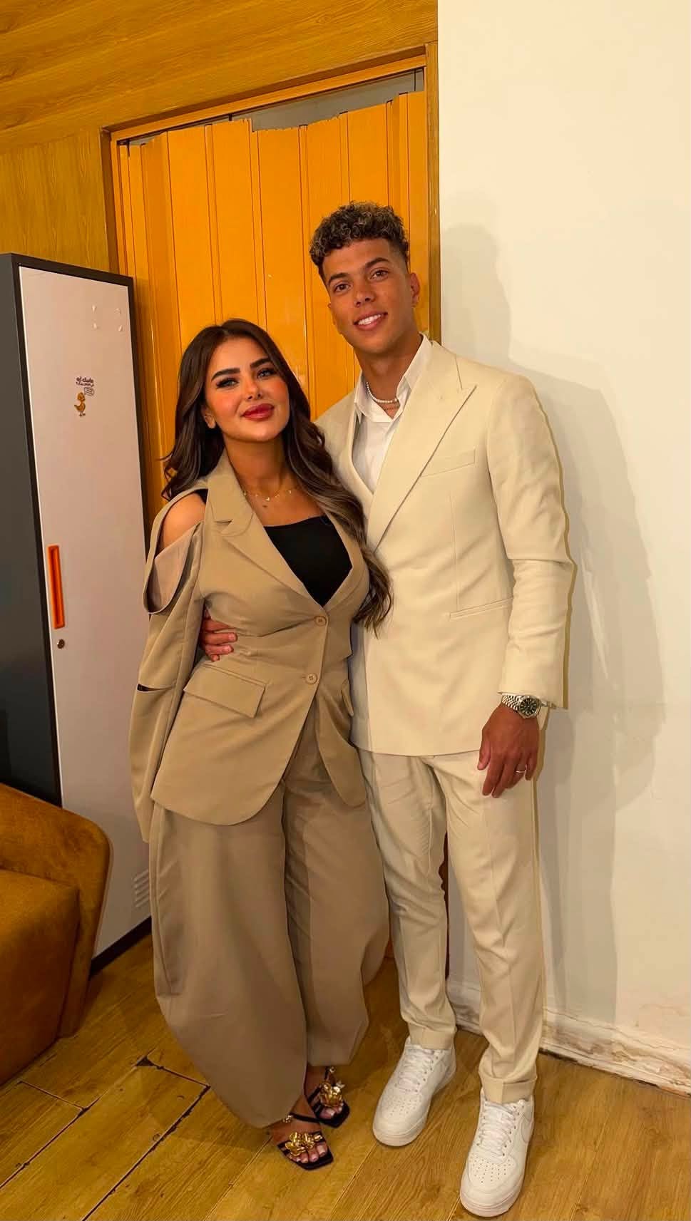 May be an image of one or more people and suit