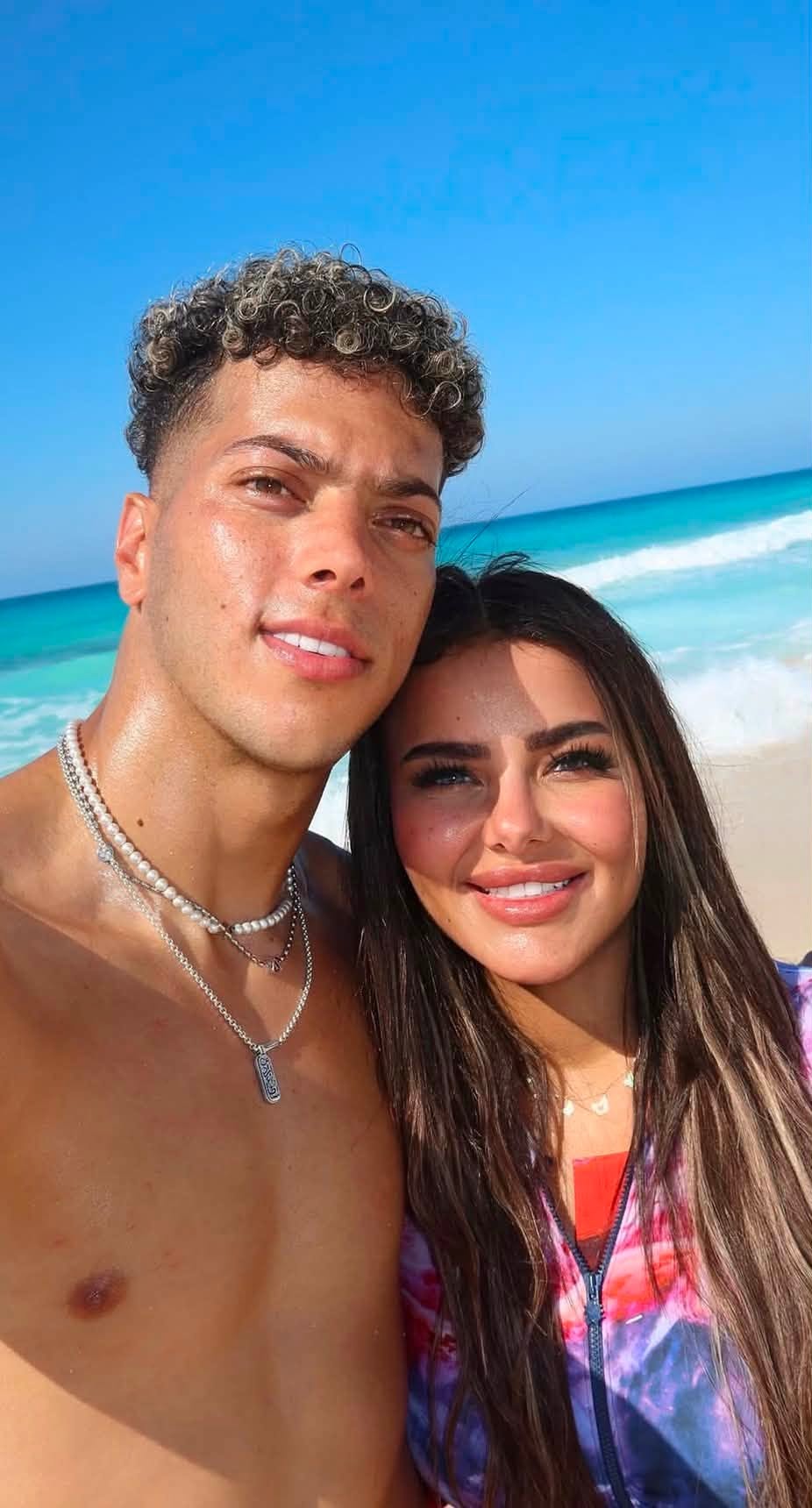 May be an image of one or more people, people smiling, ocean and beach